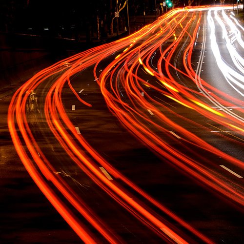 Lights Long exposure showing the flow of multiple lanes of busy on a multi-lane urban road.