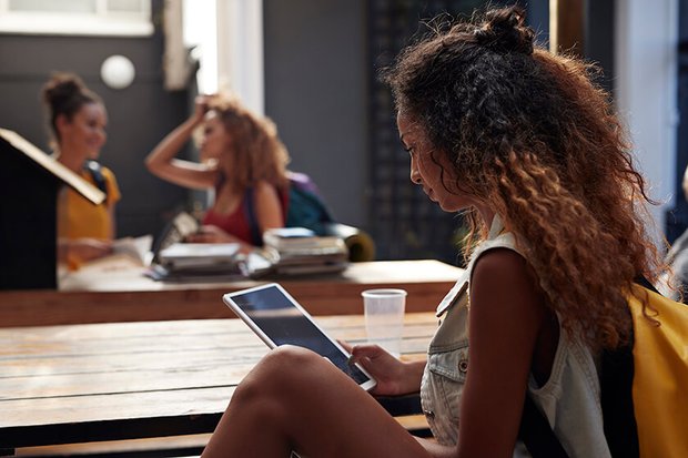 high school student studying on a tablet high school student studying on a tablet