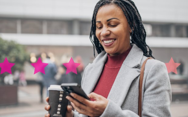 Smart Numbers Photo of smiling woman outdoors using her phone to connect with a company