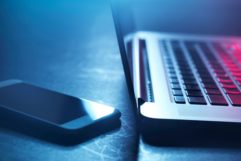 Smartphone and laptop Laptop and smartphone at night
